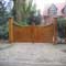 Curved gates with ornate posts